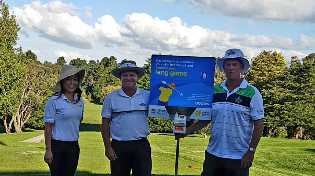 Sun aware: Natalia Atcha of the Cancer Council with pro shop manager Robert Kennedy and Stuart Liddell - Wentworth Falls Country Club Captain.
