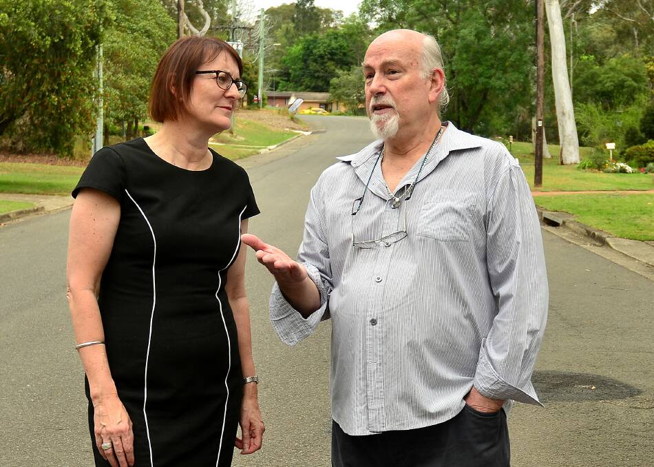 Website 'glitch': Labor Member for Macquarie Susan Templeman discusses the NBN rollout with Blaxland resident Tony Kleu.