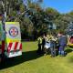 Paramedics help treat a woman in her 80s at Springwood on May 29. Picture CareFlight