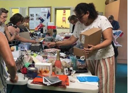 Members of the CWA Glenbrook Evening Branch prepare pamper packs for drought and fire-affected communities.