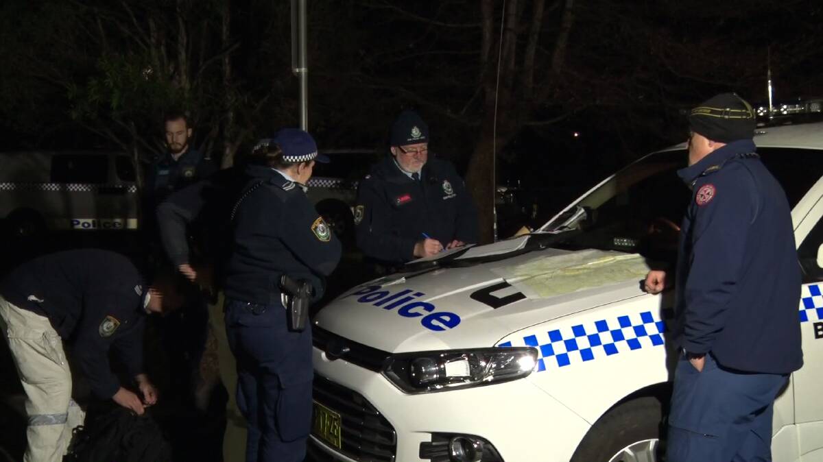 Police plan the search for the missing bushwalkers. Photo: Top Notch Video.
