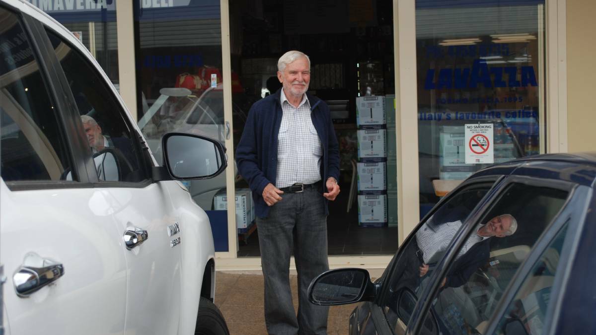 Hazelbrook's Ken Goodlet stands where his daughter-in-law, Sue, was standing when a car smashed through the deli window in Hazelbrook in 2016.