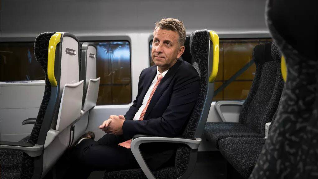 NSW Transport Minister, Andrew Constance, inside a mock carriage of the new intercity train. Photo: Janie Barrett