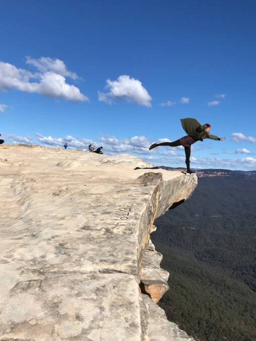 Don't try this: People are putting their lives at risk by cliff edges in the Blue Mountains to take the 'perfect photo'. Police have reminded people to be careful. Photo: Facebook.