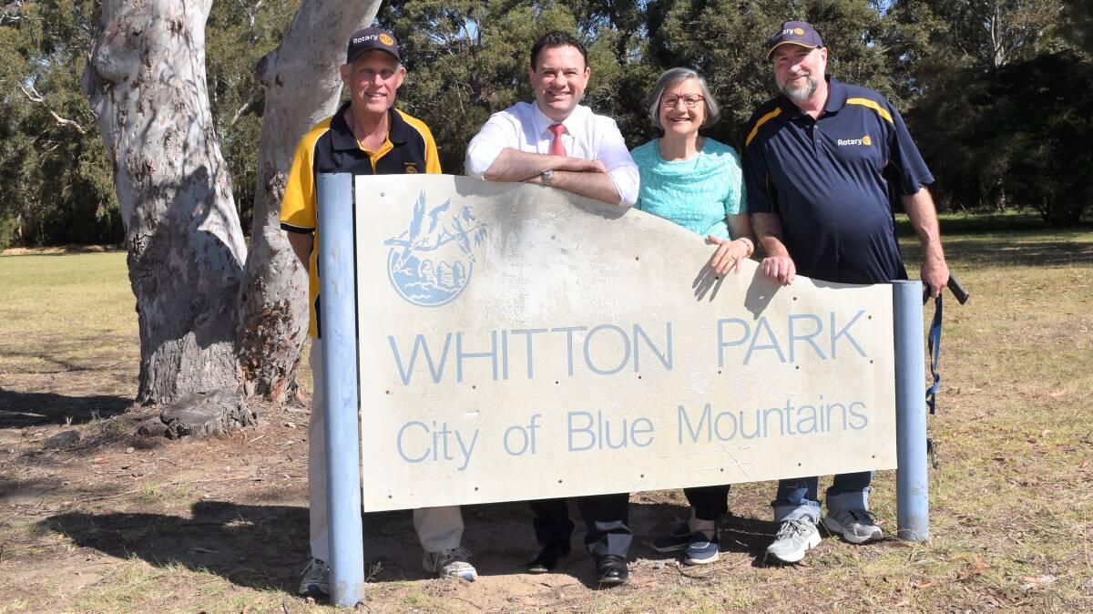 Penrith MP Stuart Ayres with Lower Mountains Rotary Club members at Glenbrook's Whitton Park. A Rotary project to build all-abilities parking and pathway to the existing shelter as well as wheelchair-friendly picnic furniture was awarded $55,000 in the My Community Project initiative.