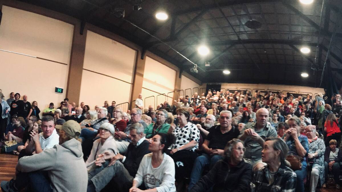 Concerned: Residents packed an RFS community meeting in Wentworth Falls on Monday night to hear news of the bushfires and back burning operations this week.