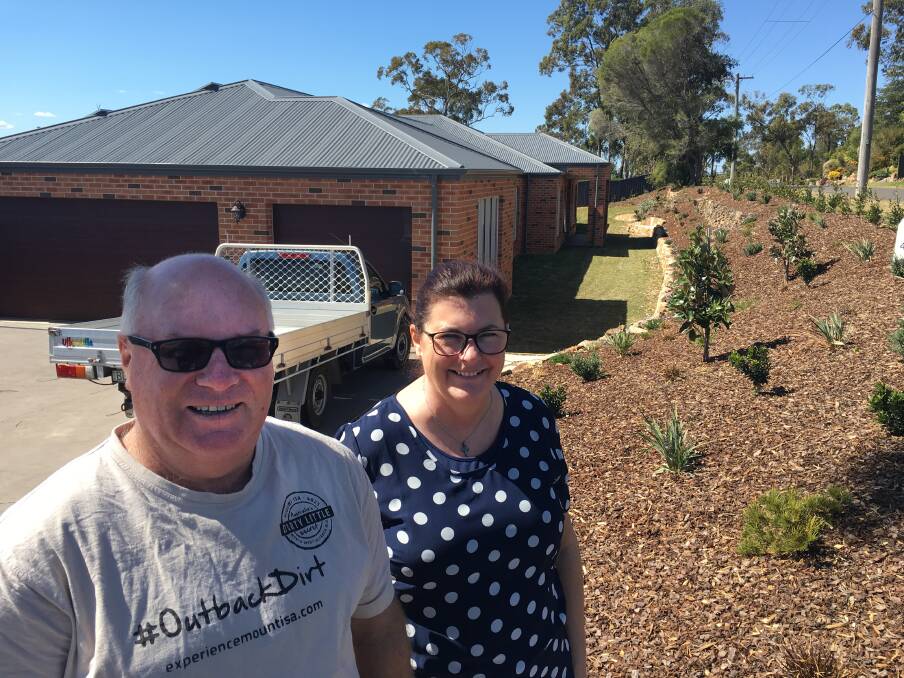 Jim and Ros McKinnon outside their new home in Winmalee.