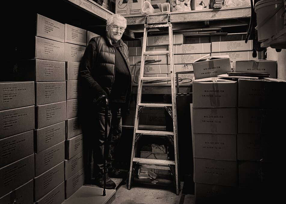 Labour of love: Katoomba photographer Peter Adams surrounded by the first print run of his book, A Few of The Legends. Photo: John Swainston.