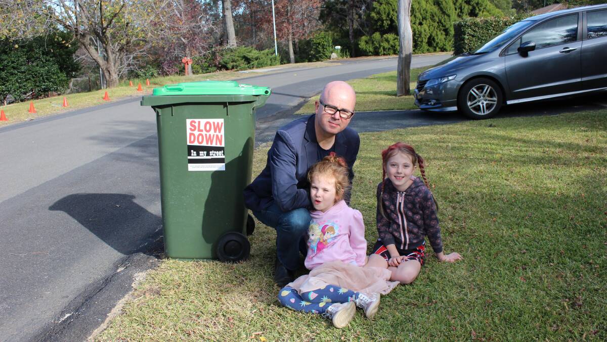 Blue Mountains mayor Mark Greenhill is urging residents to support a road safety campaign by putting stickers on their garbage bins.