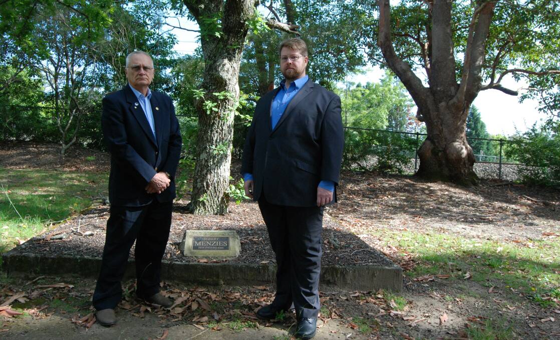Blue Mountains City councillors, deputy mayor Chris Van der Kley, and Ward 3's Daniel Myles, next to Liberal Party founder Robert Menzies' tree in the Prime Ministers' Corridor of Oaks at Faulconbridge.