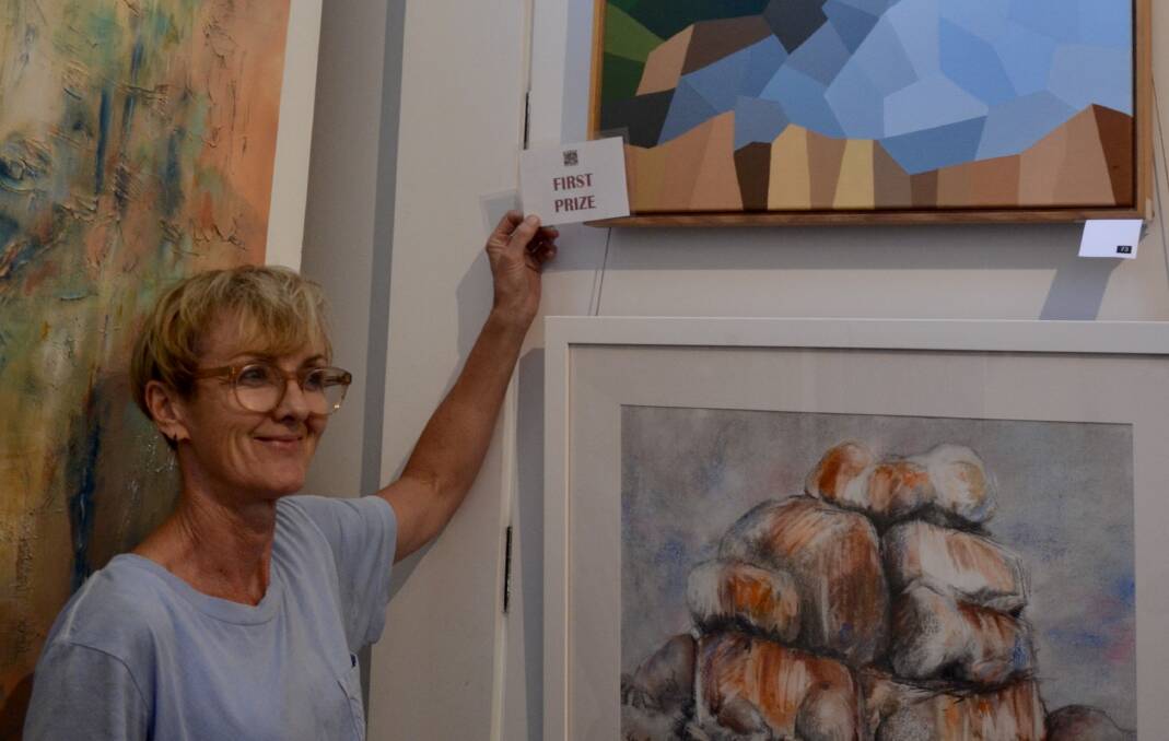 Jody Graham judges the Blackheath Art Society Easter Exhibition in 2021. First Prize went to John Marsh for his painting, "Early Autumn". Picture - Kylie Blakemore