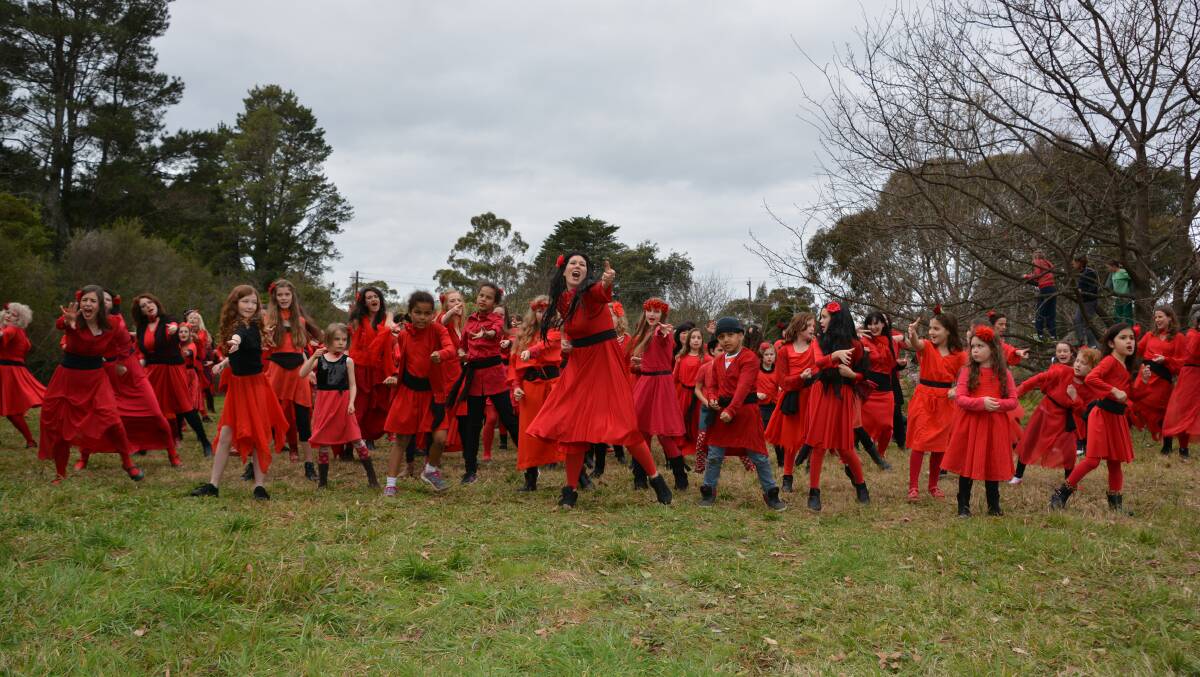 An estimated 200 people recreate the music video for Kate Bush's number 1 hit from 1978, Wuthering Heights, at Woodford Academy. 