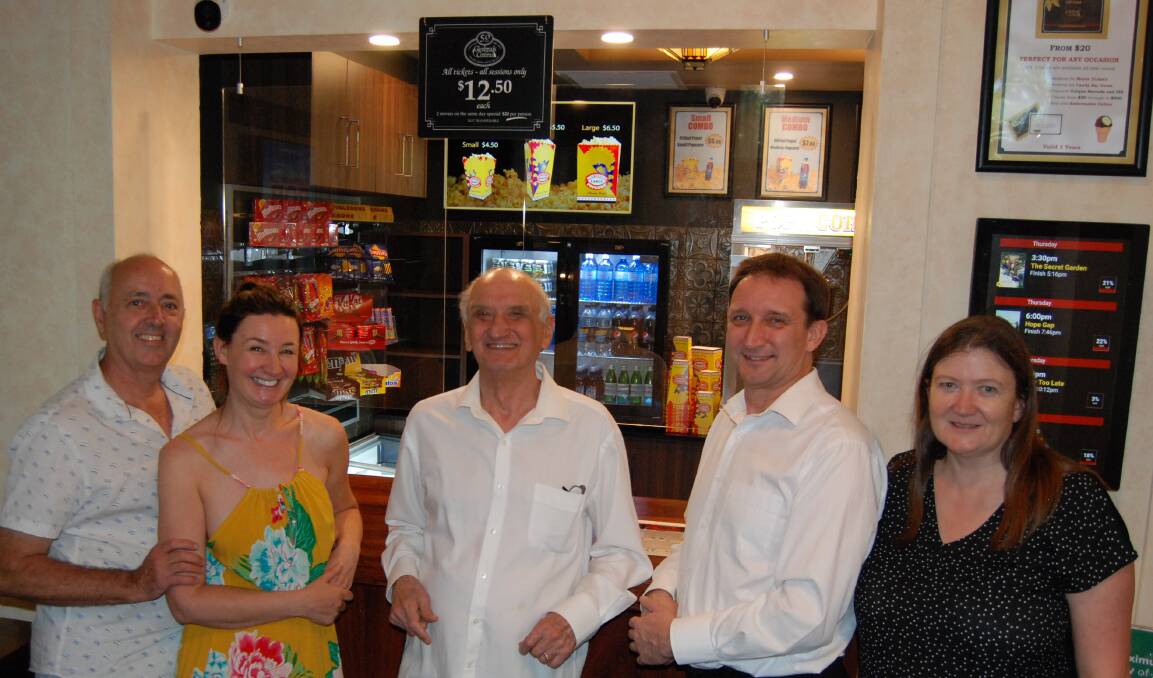 Family affair: Glenbrook Cinema owner Ron Curran (centre) with his daughter Tamara and her husband Tim (left), and son Ben and his wife Fiona in front of the cinema's revamped candy bar.