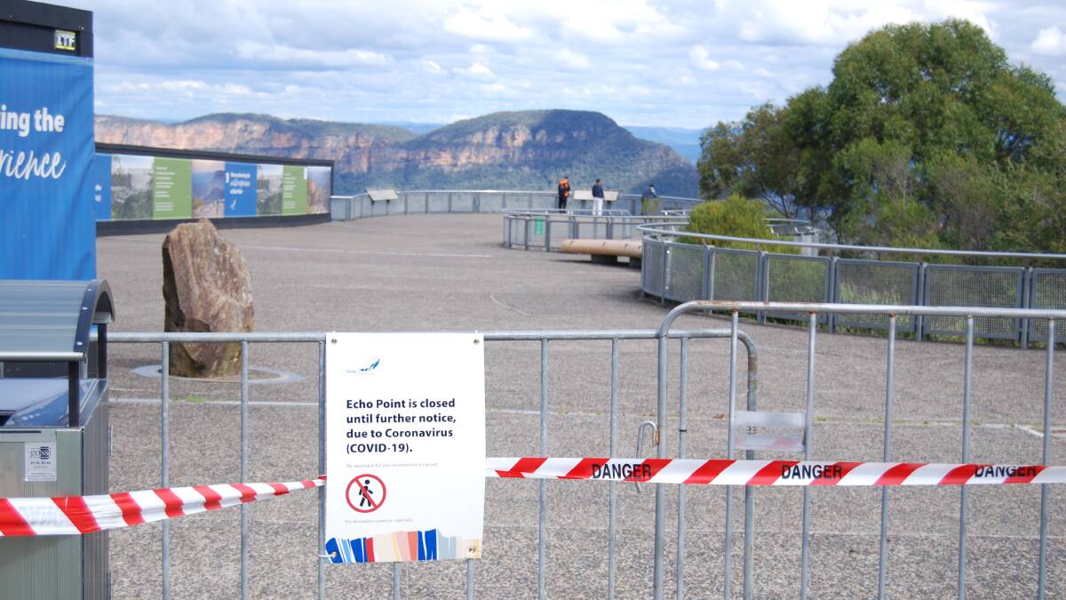 Closed: Despite barriers, a couple of people ignored the signs at Echo Point on Monday.