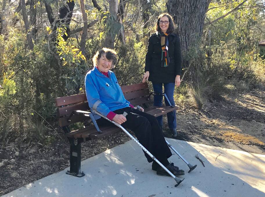 New addition: Ward 2 Councillor Romola Hollywood with local resident Simone Bowskill at the new bus stop seat on Blaxland Road and Darwin Avenue, Wentworth Falls.