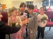 Children Valentina, Aurora, Leonardo and Atlas take part in the Anzac Day Commemoration Service held at Uniting Springwood aged care home. Picture supplied