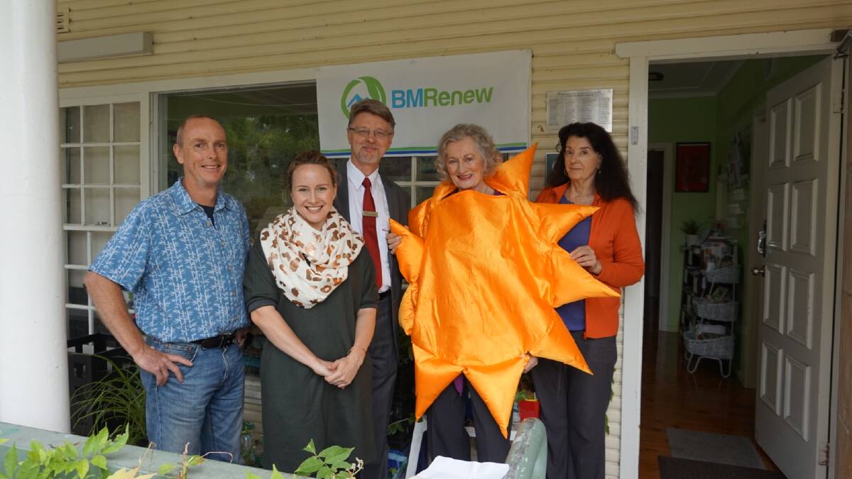 Making a difference: Standing in front of the new plaque, from left, Gary Caganoff (Sun-Kissed Solar), Marnie Tomczyk (BMRenew), Richard Wadick (Westpac), Noni McDevitt (BMRenew), Morna Colbran (Winmalee Neighbourhood Centre).