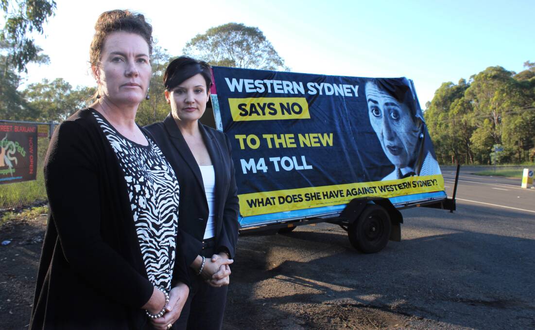 Blue Mountains MP Trish Doyle and opposition roads spokeswoman Jodi McKay at Lapstone with a mobile billboard attacking the reintroduction of the M4 tolls.