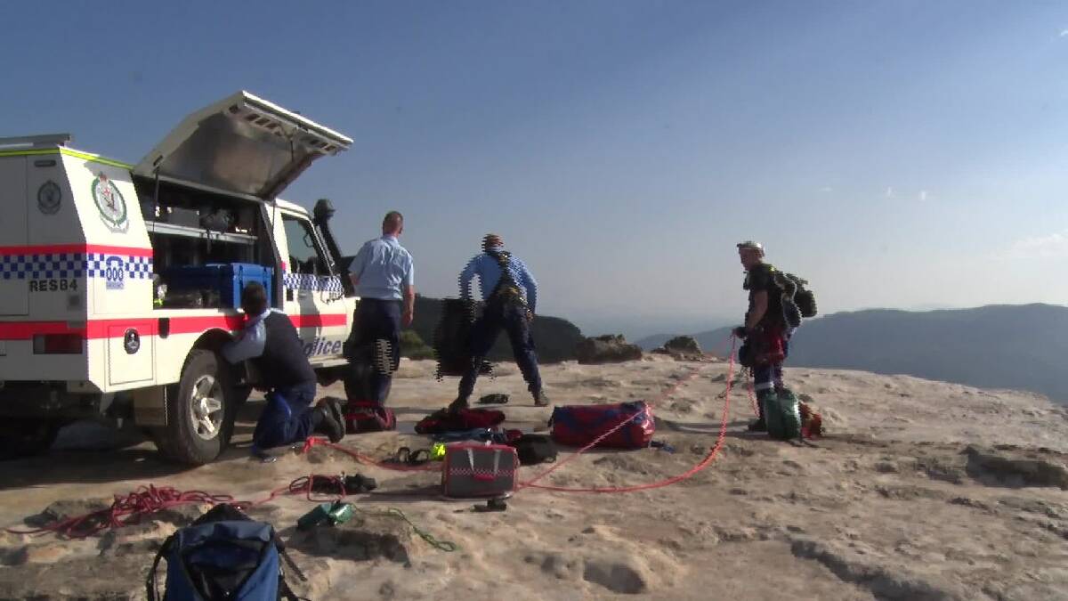 Lookout warning: Police at the rescue at Lincoln's Rock on January 14 after a teenager fell from a cliff edge. Photo: Top Notch Video.