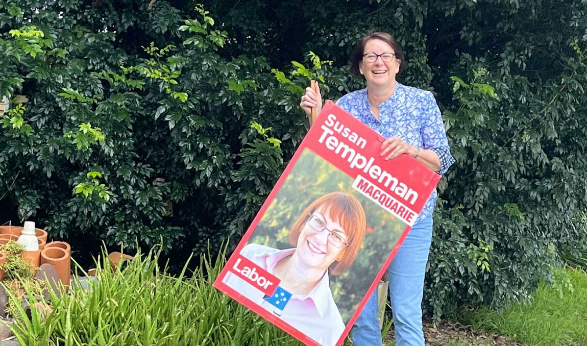 Federal Member for Macquarie Susan Templeman taking down a corflute post-election.