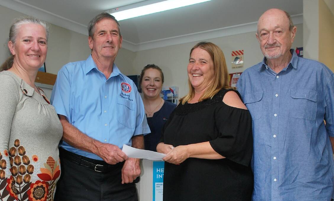 Foundation Day helps hospital: Festival committee member Kim Cowper makes the contribution to auxiliary president Richard Jackson-Hope with committee colleagues Jen Stevens and Ken Hambly under on-duty nurse April Cavanagh's approving eye.