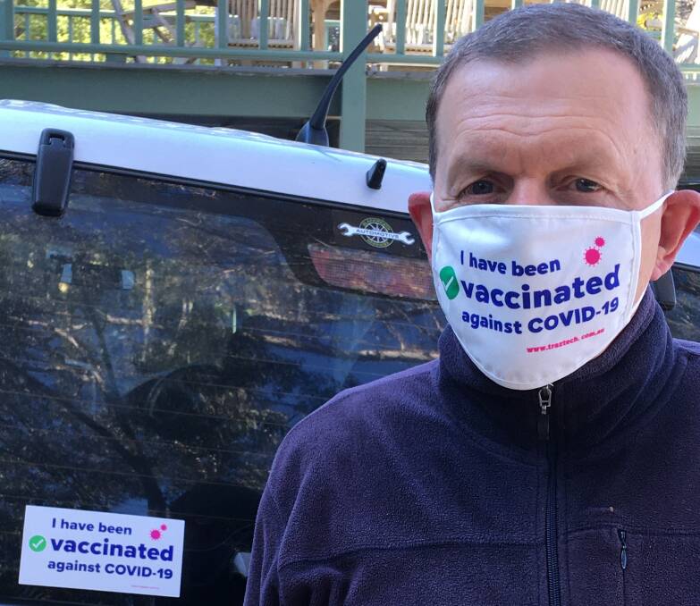 Dr Barry Werth wears his "I have been vaccinated against COVID-19 mask".