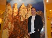 General Manager of LEGO Australia and New Zealand, Troy Taylor, next to the Three Sisters mosaic at the Lego Store in Penrith Westfield.