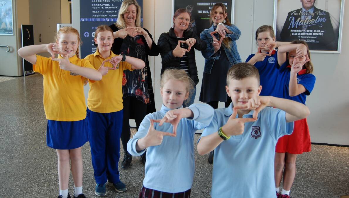 From left, Glenbrook Public School students Daisy Haythornthwaite and Caela Sagon, Ellison Public School students Vivienne (last name withheld) and Lucas Paton, Springwood Public School students Seth Weston-Cole and Evie Smith with Blue Mountains Theatre's Yvonne Hellmers, and teachers Jacqui Weston-Cole and Sarah Johnson.
