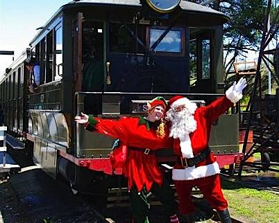 Welcome visitors: Santa and one of his helping elves will hop on a steam train at Valley Heights Railway Museum on December 12 and 13.