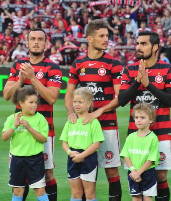 Line-up time: Blue Mountains Football Club juniors join Western Sydney Wanderers players before kick-off at Parramatta Stadium on December 12.