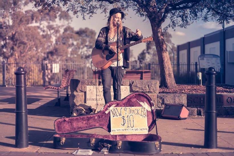 Karl-Christoph busks in the Springwood town square.