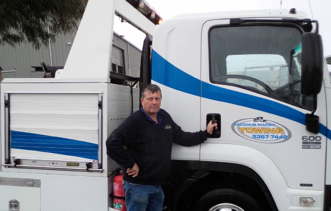 Bacchus Marsh Towing's Trevor Oliver and the truck which has now been banned by VicRoads. 