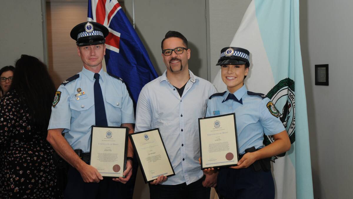 Presentation: Senior Constable Graeme Gray, Saleh Henkel, and Constable Emily Sims at the awards presentation. Picture: NSW Police.