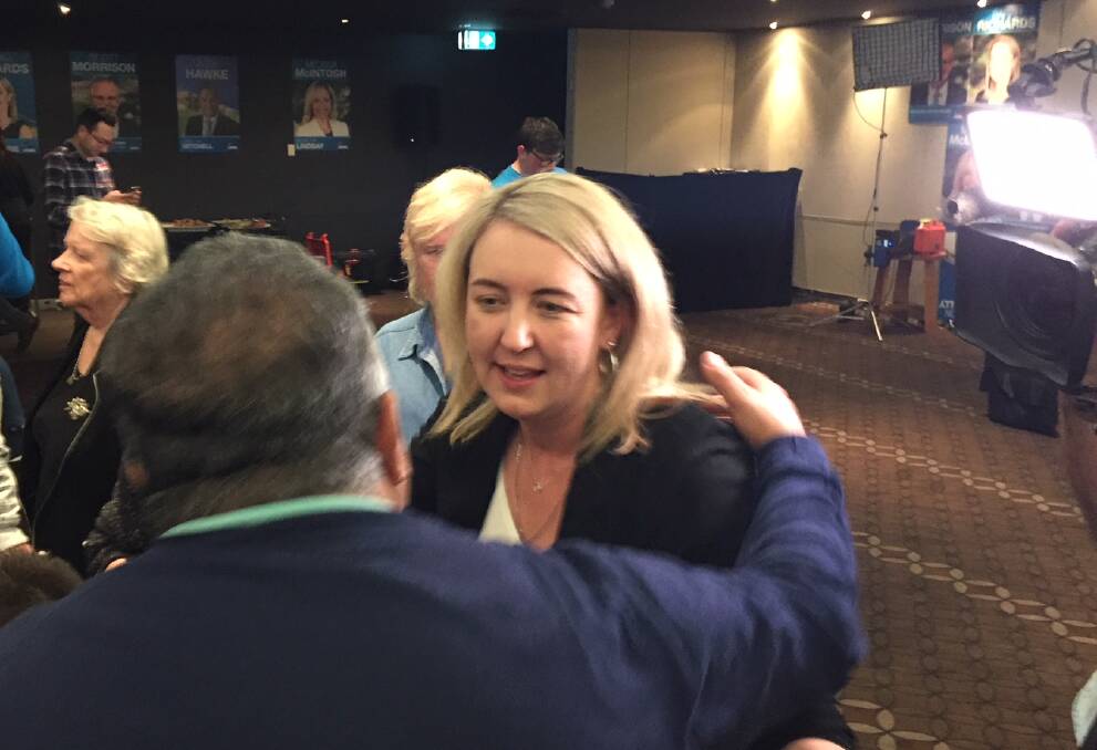 Liberal candidate Sarah Richards hugs supporters after saying the vote was too close to call. At 10pm Ms Richards was ahead in the polls, however.