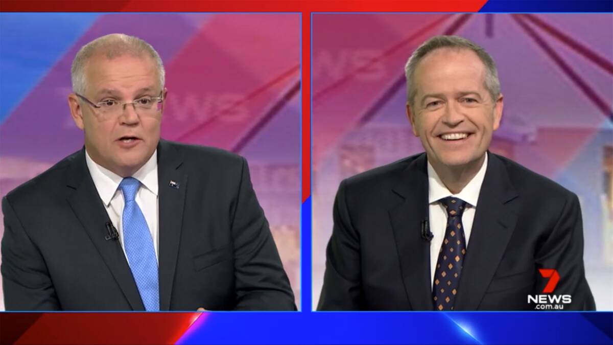 Nothing to see here: Prime Minister Scott Morrison and Opposition Leader Bill Shorten speak during the first leaders forum at the Seven West Media Studios in Perth on Monday night. Picture: AAP, Seven Network 