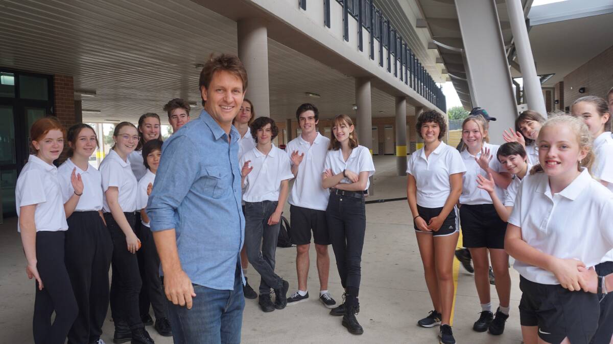 Pictured with ABC's Big Weather presenter, Craig Reucassel: Springwood High students appeared on the ABC's Big Weather program recently complaining about the lack of air conditioning in their hot classrooms.