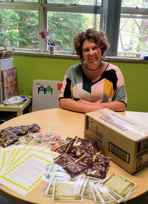 Katoomba High head teacher of wellbeing, Angie Wilson, surrounded by hot chocolate sachets being sent out to almost 1000 Katoomba High students this week.