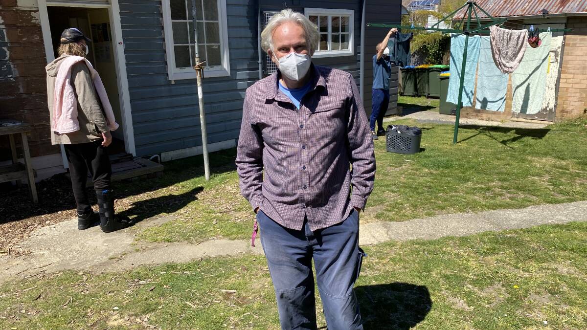 Helping the homeless of the Mountains: Stephen Bradley in the Junction 142 yard in Katoomba with shower and laundry service clients. They are appealing for funding.