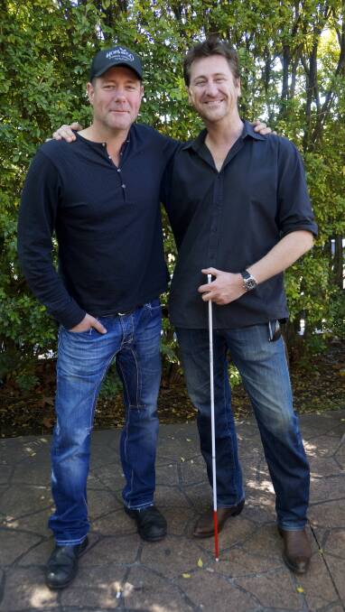 Brothers in arms: Springwood musician Drew McAlister (left) with his brother Kurt who suffers with RP.