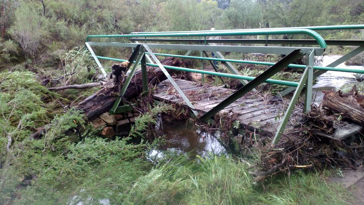 No walks here for a while: A broken bridge on the popular Charles Darwin walk which was damaged in the recent downpour.