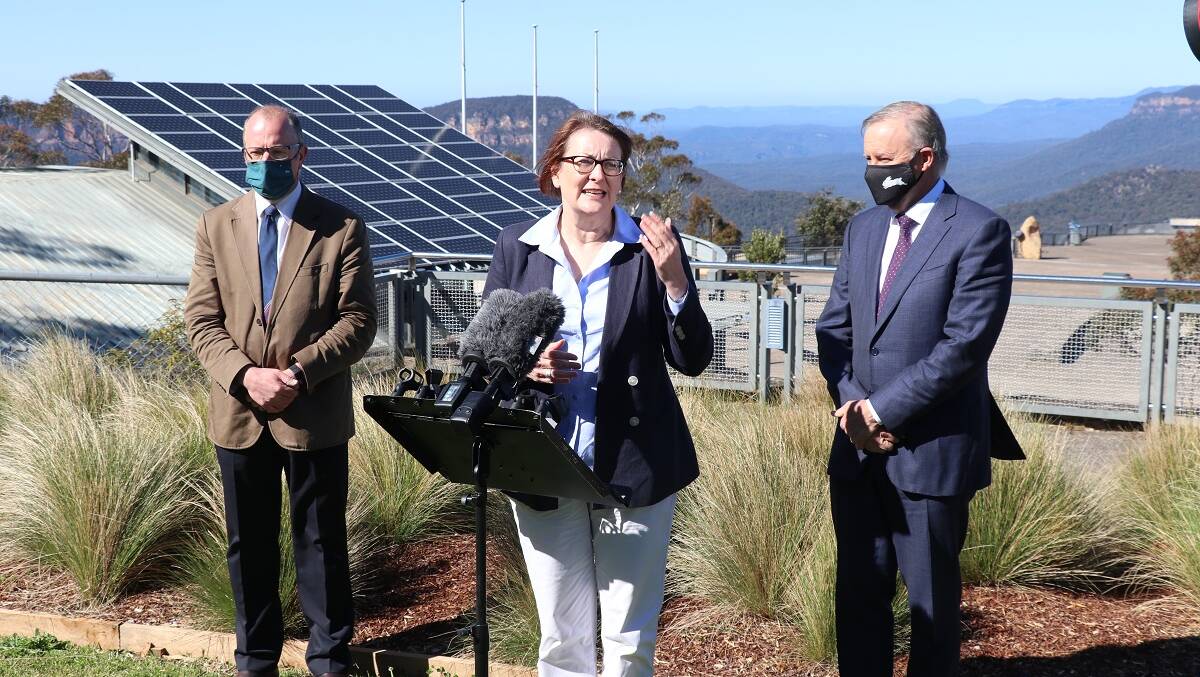 Susan Templeman speaks to the media watched on by Jason Cronshaw and Anthony Albanese at Echo Point, Katoomba which remains closed due to COVID.