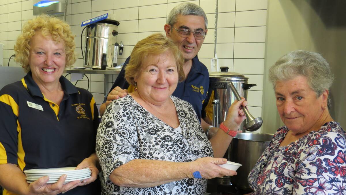 Helping others: Rotarians Sue Parnell and Peter Agar (back) visit one of last year’s winners, Carol Williams, pictured with Sandra Henry.