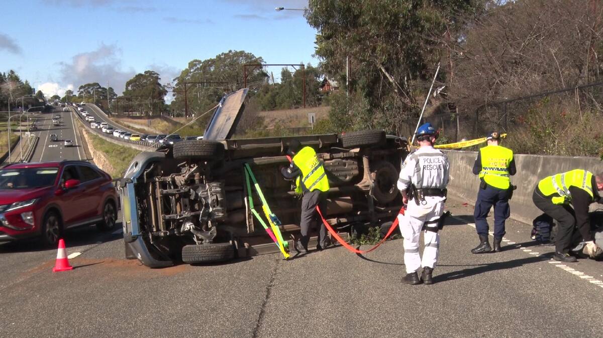 Frightening accident: Investigations are continuing after a 4WD rolled onto its side on the Great Western Highway at Leura.