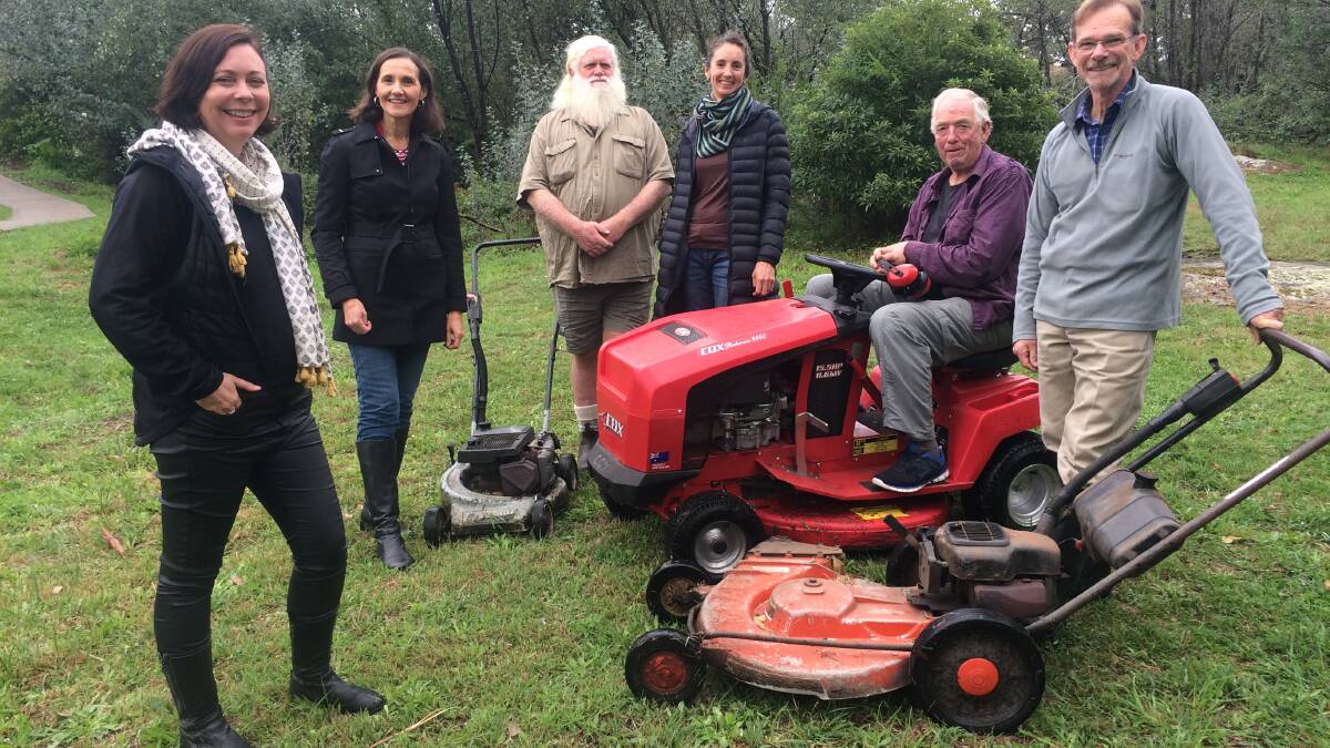 Deputy Chair Woodford Academy Elizabeth Burgess, Cr Romola Hollywood, Ian Robinson, Chair Woodford Academy Felicity Anderson, Bob Morris and Max Hill. Other lawn mowers (not pictured) are Tony Gorey and Mark Vanderwey. 