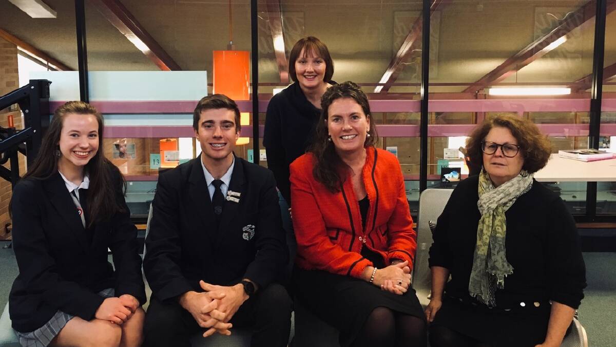 BHS library glass barriers with (Lto R) captains Lara Busby and Argus Guy, Robyn Totenhofer BHS P&C president, MP Trish Doyle and librarian Sharon Lawrence