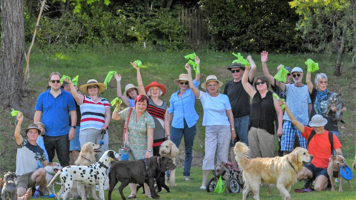 Thing of the past: Plastic poo bags are long dog-gone thanks to community initiative. Lesley Harrowsmith(in white t-shirt) with other dog owners and the new compostable bags at Leura dog park.
