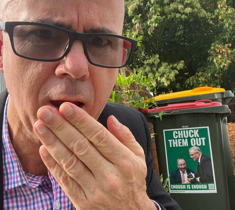 Bins can continue to be political billboards: Mark Greenhill and his bin before the federal election with a picture of the former Liberal Prime Minister Scott Morrison.