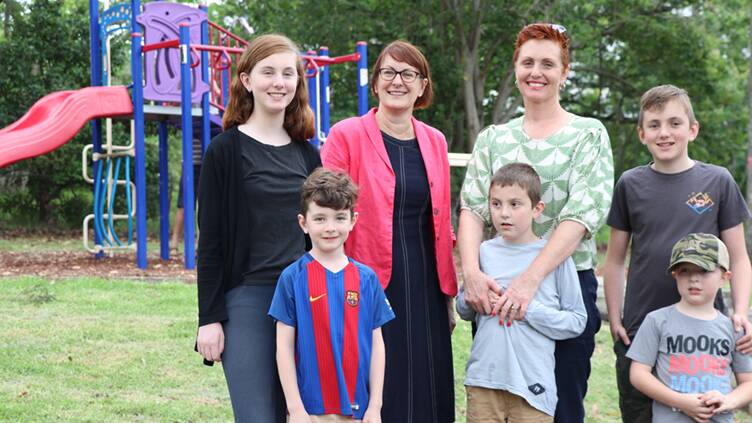 At Buttenshaw Park where there is some inclusive equipment: MP Susan Templeman and Jane Renneberg-Bles with her four children Eliza, Archer, Rocky and Oliver Bles and friend Cove Delaney. 