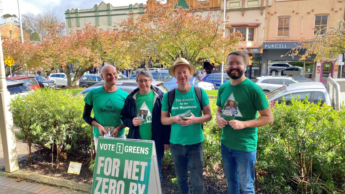 Macquarie Greens candidate Tony Hickey (left) campaigning with supporters in Leura.