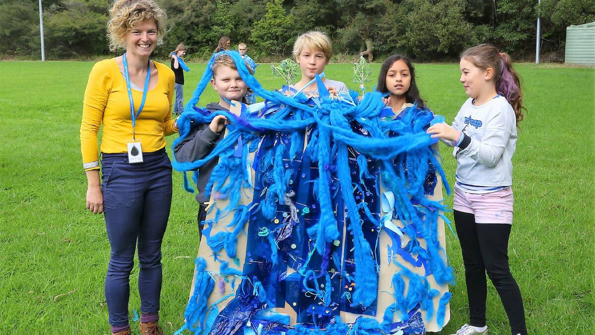 
Yes we can: Artist Georgina Humphries and students from Korowal School display their waterfall sculpture.